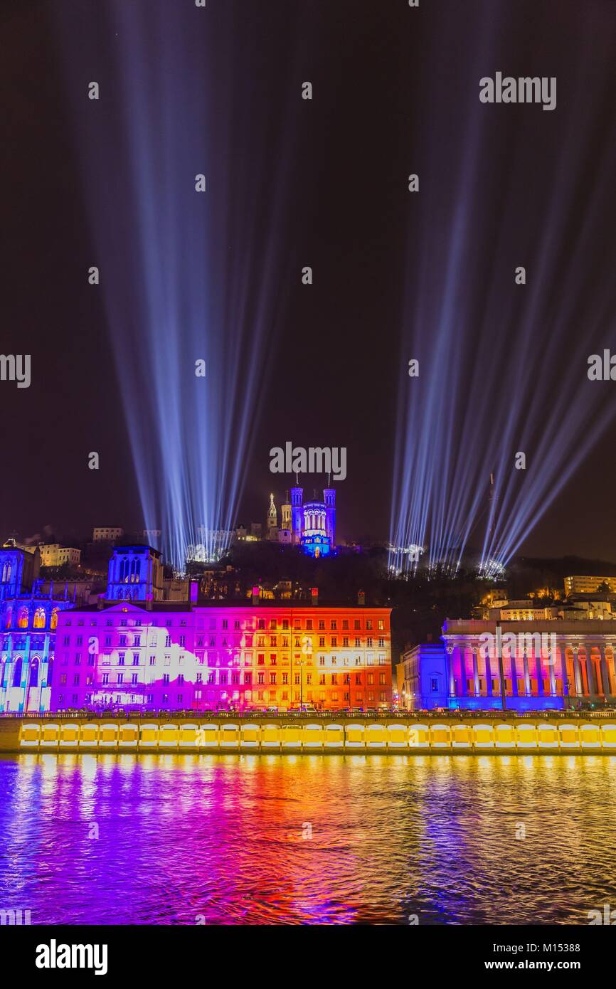 France, Rhone, Lyon, historical site listed as World Heritage by UNESCO, St Jean Cathedral, the courthouse at the edge of Saone River and Notre Dame de Fourviere Basilica during the Fete des Lumieres (Light Festival), show Time For Light of Les Orpailleurs de Lumière Stock Photo