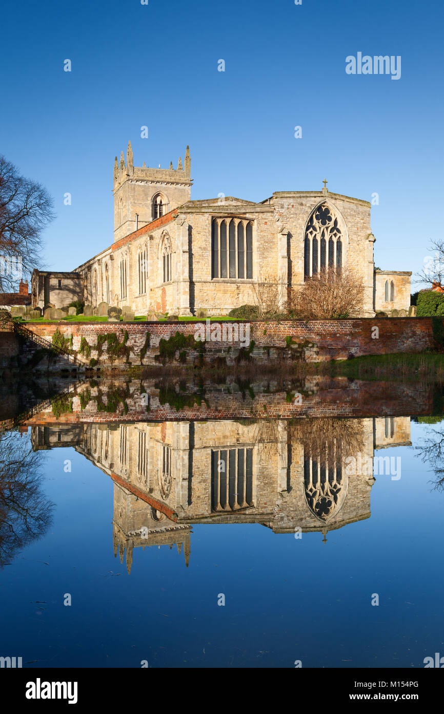 St. Mary's Church reflected in the Beck. Barton-upon-Humber, North Lincolnshire, UK. January 2018. Stock Photo