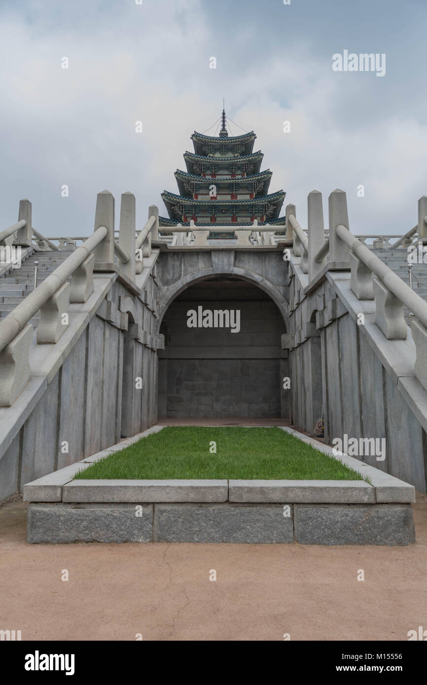 Two sets of steps leading up to a palace, with a large archway and other architectural details, in Gyeongbokgung Palace, Seoul, South Korea Stock Photo