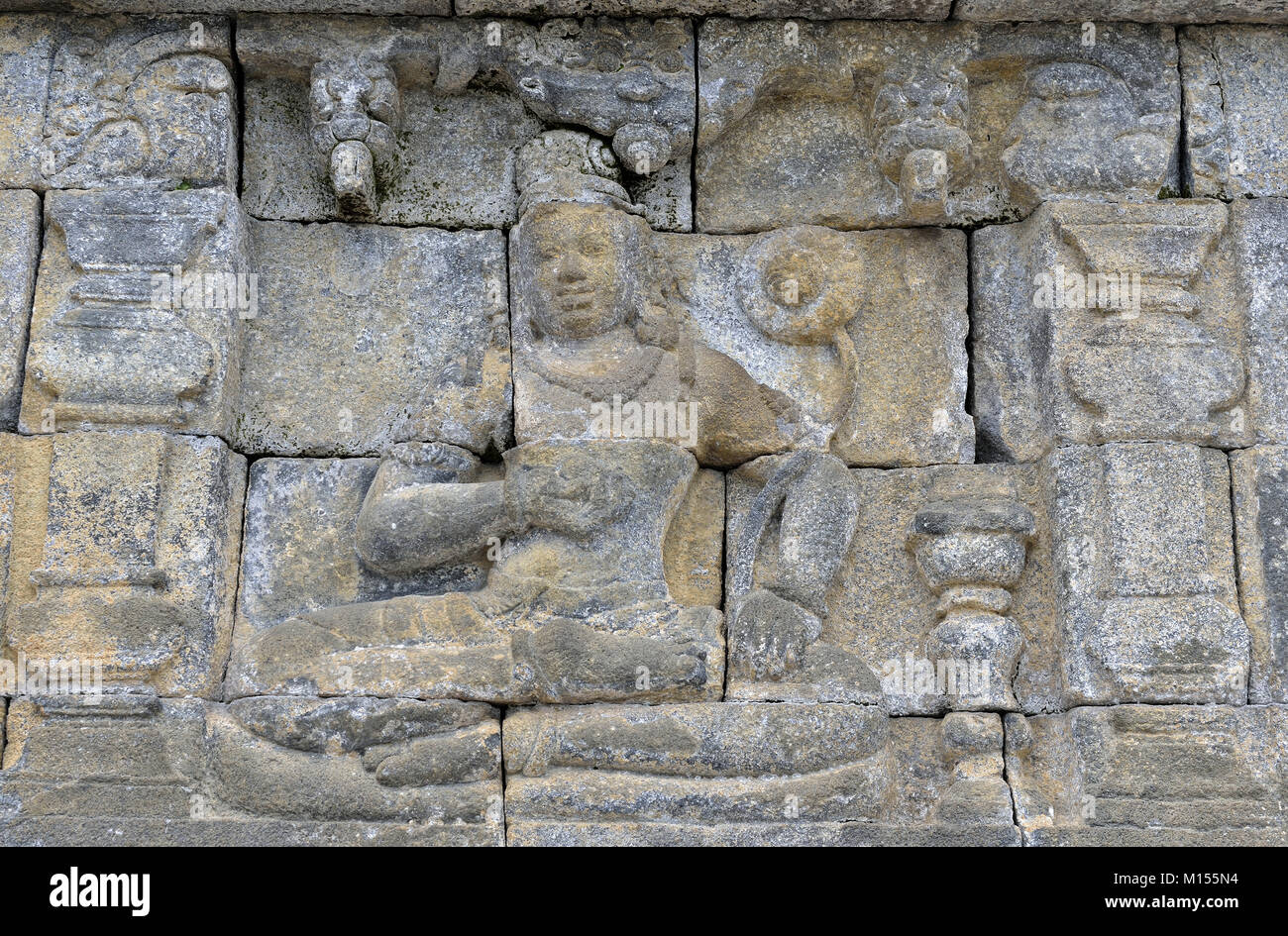 Detail of Buddhist carved relief in Borobudur temple in Yogyakarta, Java, Indonesia.. Stock Photo