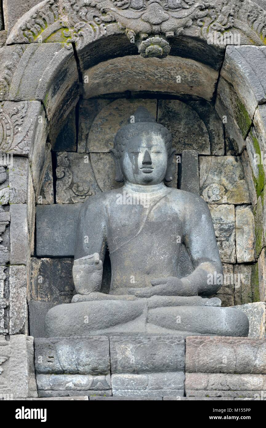 Detail of Buddhist carved relief in Borobudur temple in Yogyakarta, Java, Indonesia.. Stock Photo