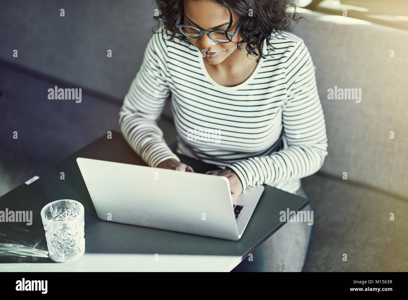 Woman working focused on laptop hi-res stock photography and images - Alamy