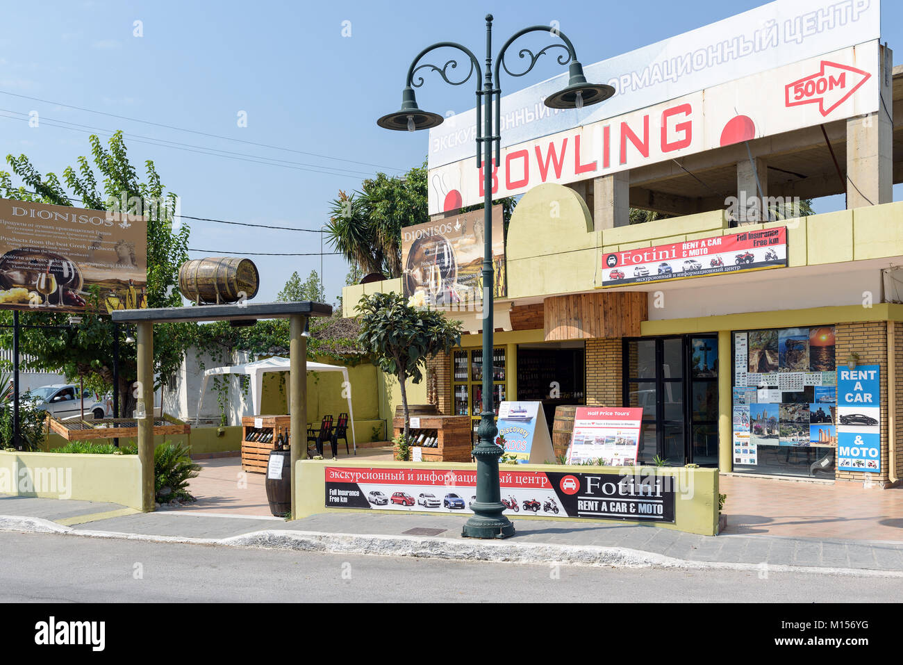 FALIRAKI, GREECE AUGUST 2017 Wine shop with vintage lamp post on