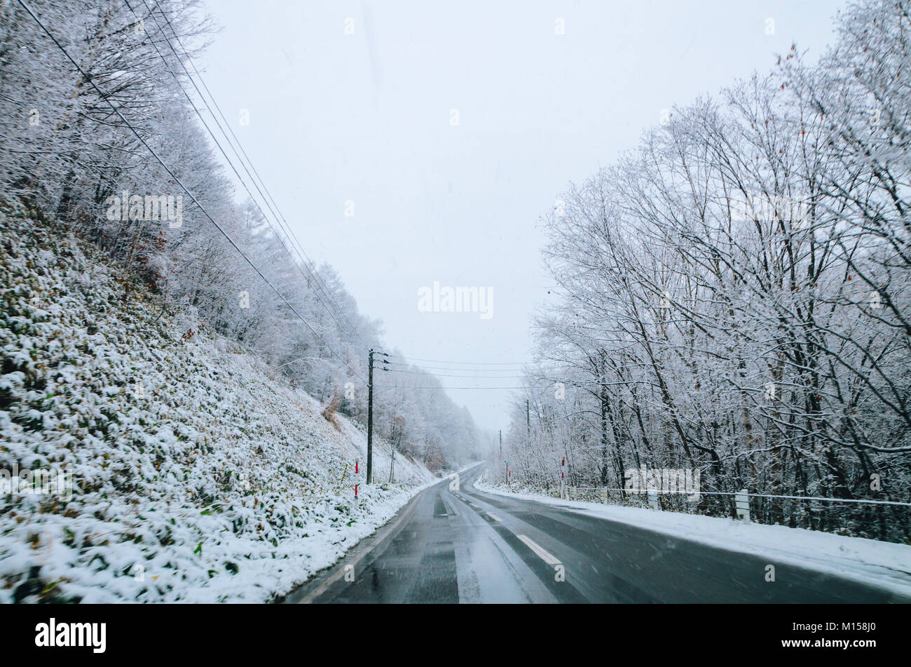 Amazing winter view along the road from Furano to Biei, located in Hokkaido, Japan famous for it's blue pond. Driving in Hokkaido is amazing. Stock Photo