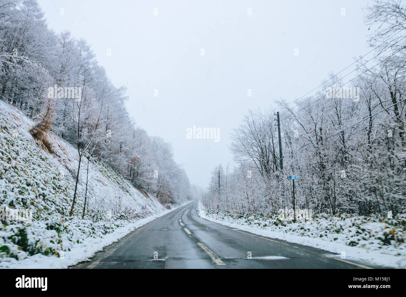 Amazing winter view along the road from Furano to Biei, located in Hokkaido, Japan famous for it's blue pond. Driving in Hokkaido is amazing. Stock Photo