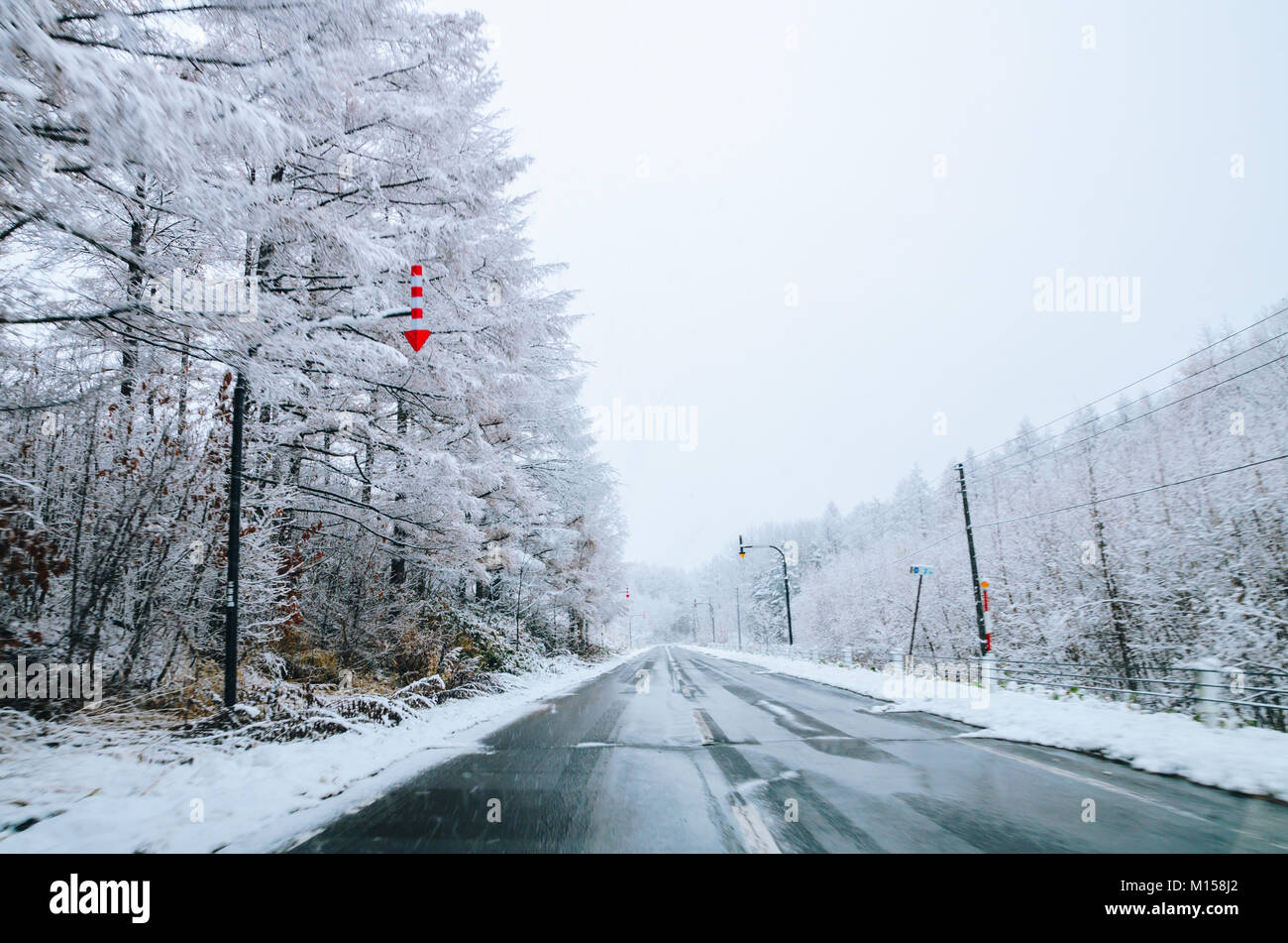 Amazing winter view along the road from Furano to Biei, located in Hokkaido, Japan famous for it's blue pond. Driving in Hokkaido is amazing. Stock Photo