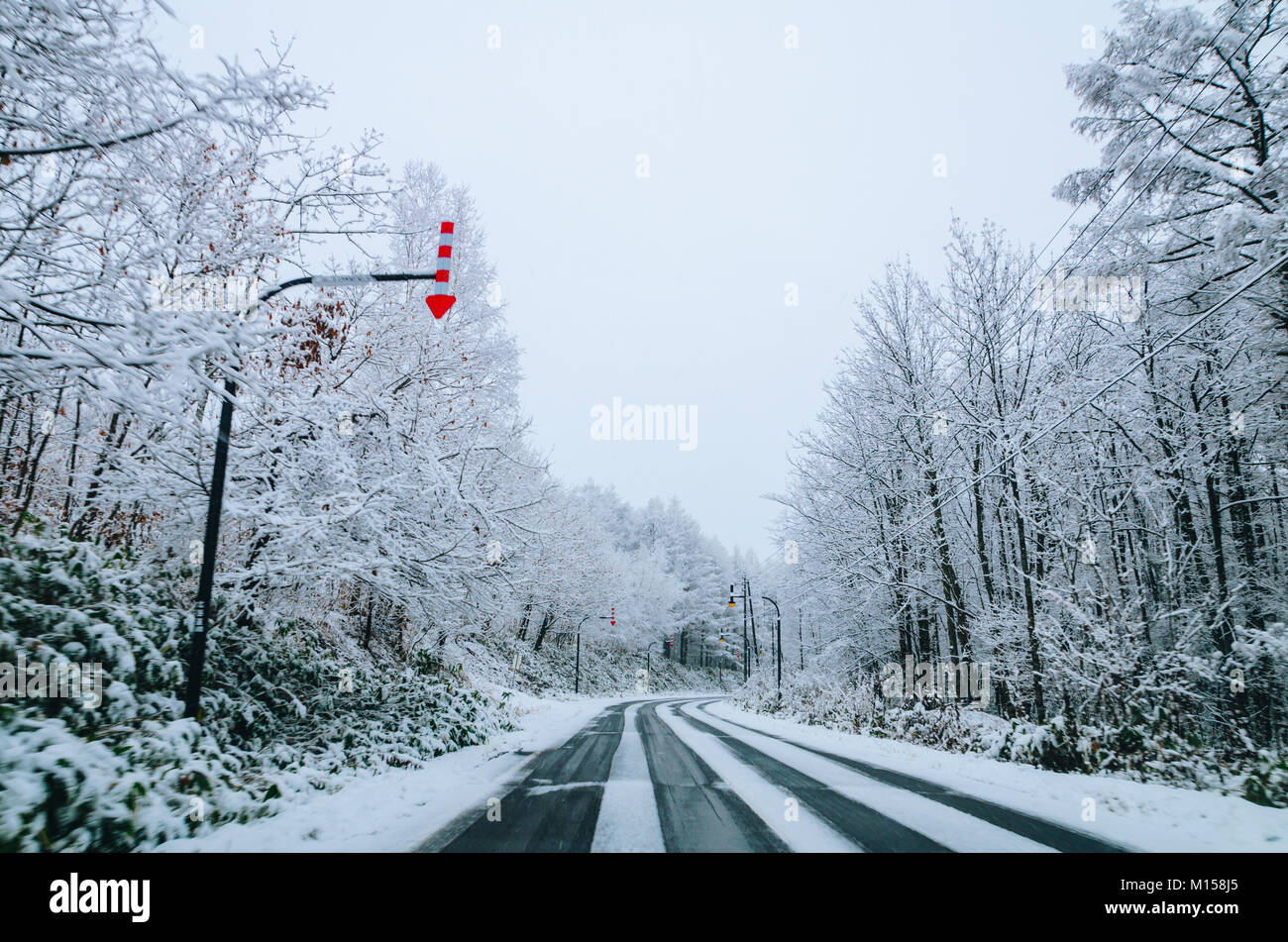 Amazing winter view along the road from Furano to Biei, located in Hokkaido, Japan famous for it's blue pond. Driving in Hokkaido is amazing. Stock Photo