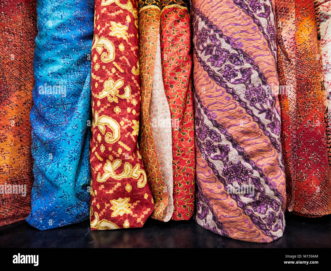 Selection of batik fabrics for sale in Hamzah Batik shop. Yogyakarta, Java, Indonesia. Stock Photo