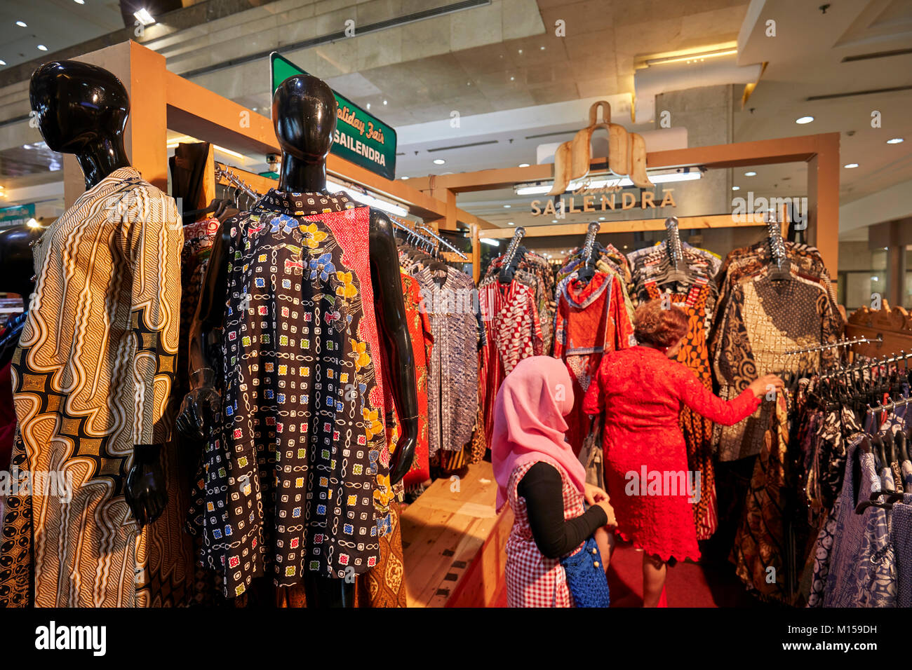 A selection of traditional Indonesian batik clothing in Batik Sailendra shop. Yogyakarta, Java, Indonesia. Stock Photo