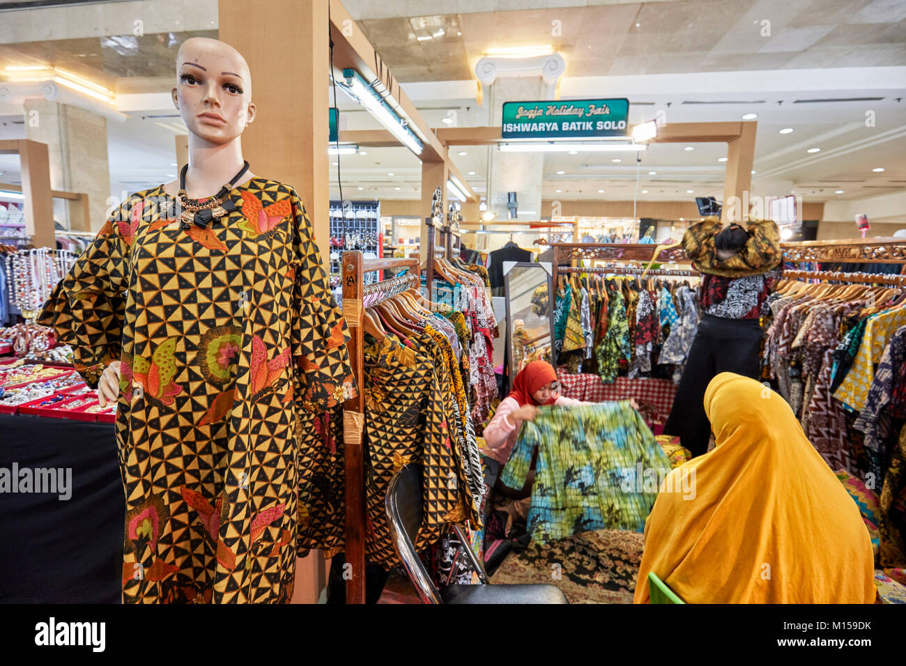 A selection of traditional Indonesian batik clothing in Batik Sailendra shop. Yogyakarta, Java, Indonesia. Stock Photo