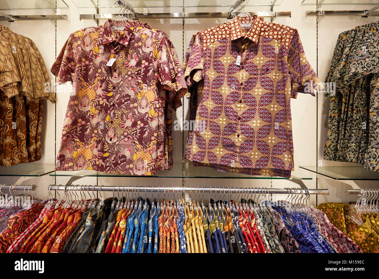 A selection of Indonesian batik shirts in a shop on Malioboro street. Yogyakarta, Java, Indonesia. Stock Photo