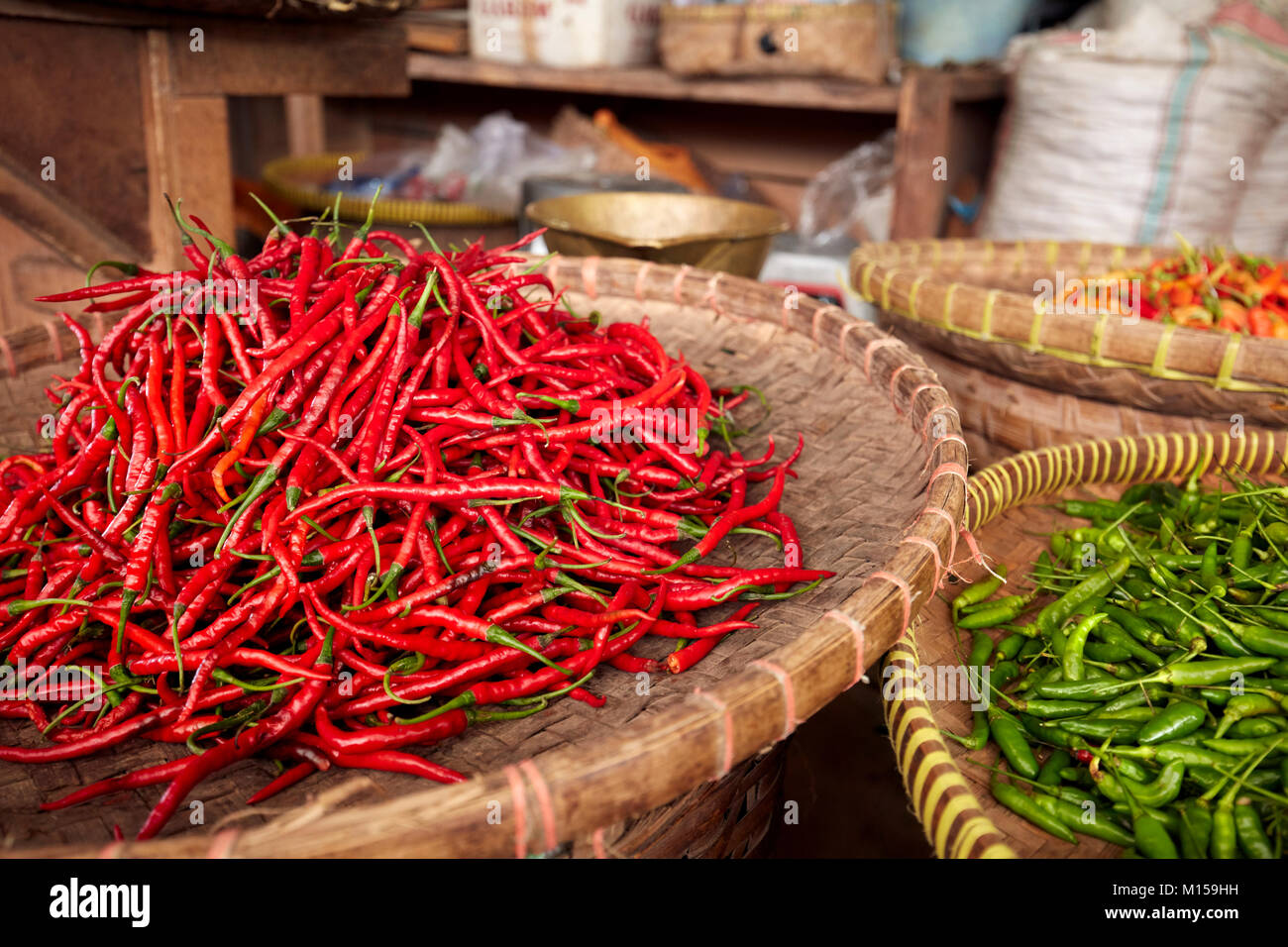 Baskets with red and green chili peppers for sale at Beringharjo Market (Pasar Beringharjo