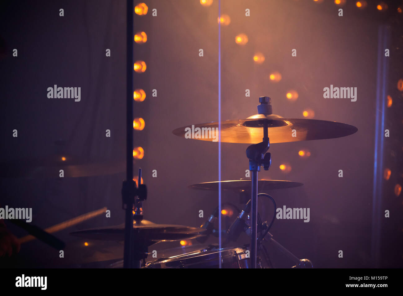 Live music photo, drum set with cymbals and stage lights on a background Stock Photo