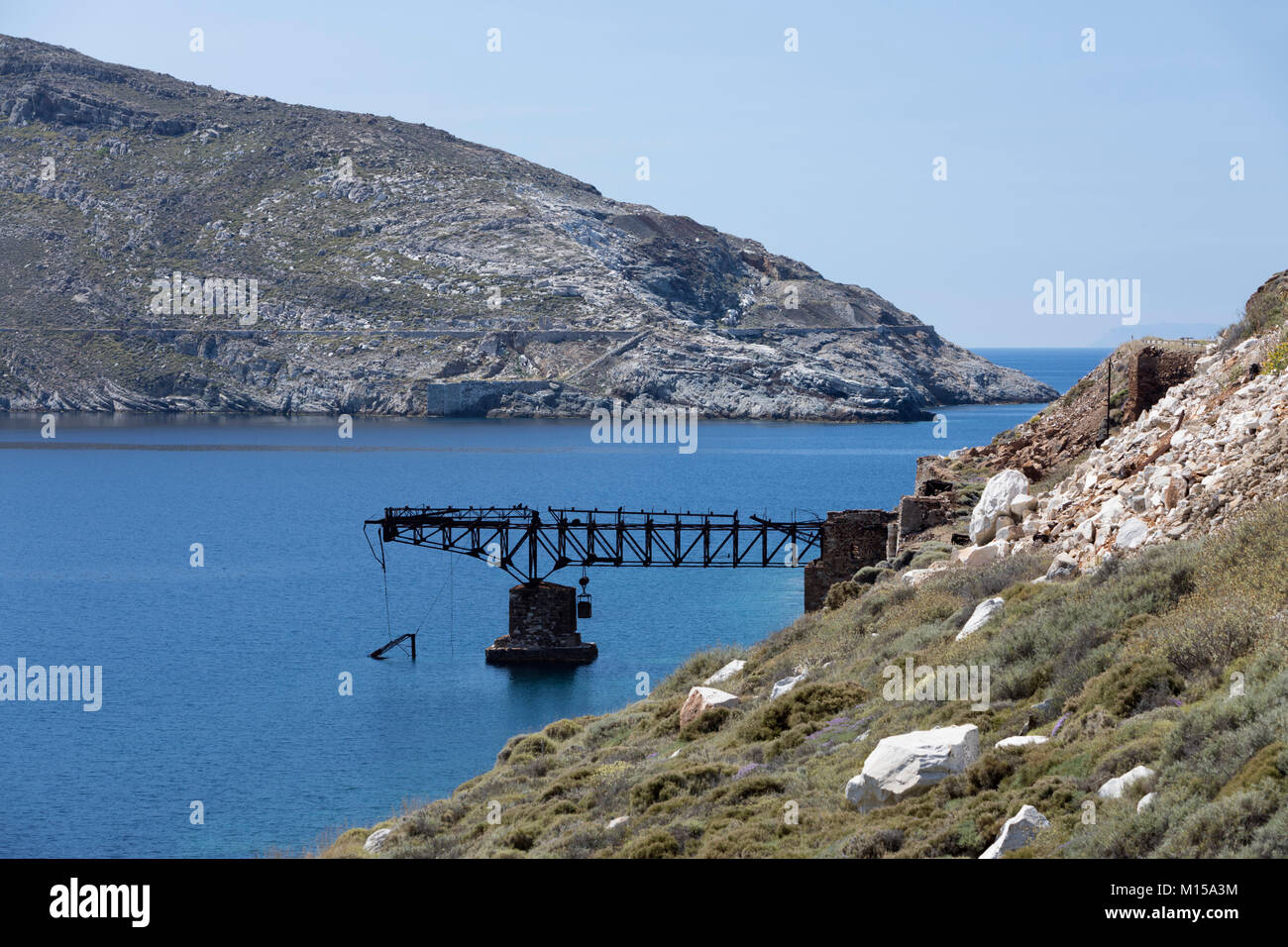 Rusty remains of old mining pier at Koutalas bay on island's south east coast, Serifos, Cyclades, Aegean Sea, Greek Islands, Greece, Europe Stock Photo