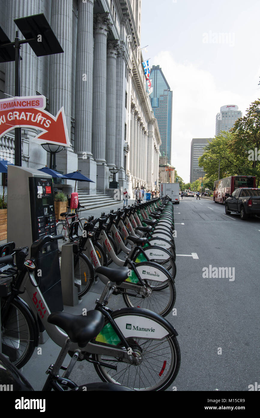 Montreal Canada bicycles in rack fast speed electric bikes parked charging read to use