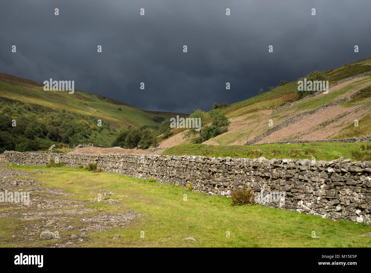 Dark clouds over Gunnerside beck in Swaledale, North Yorkshire, England. Stock Photo