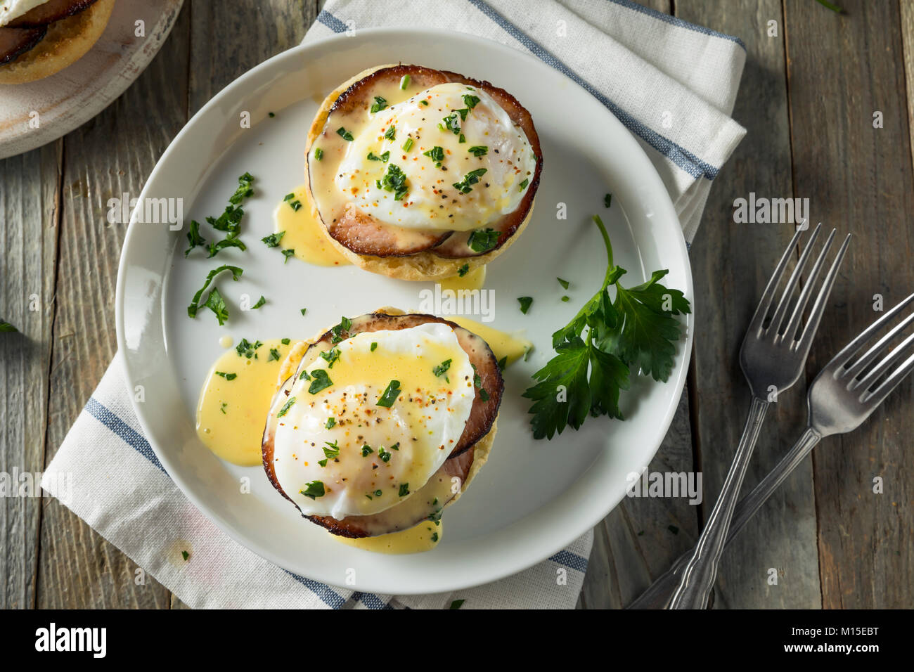 Homemade Eggs Benedict with Bacon and Hollandaise Sauce Stock Photo Alamy