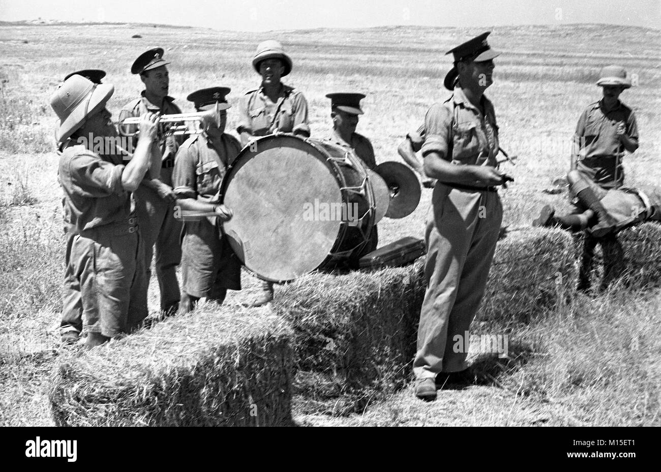 British army soldiers and miltary band having fun and entertainment in Palestine 1940 Stock Photo