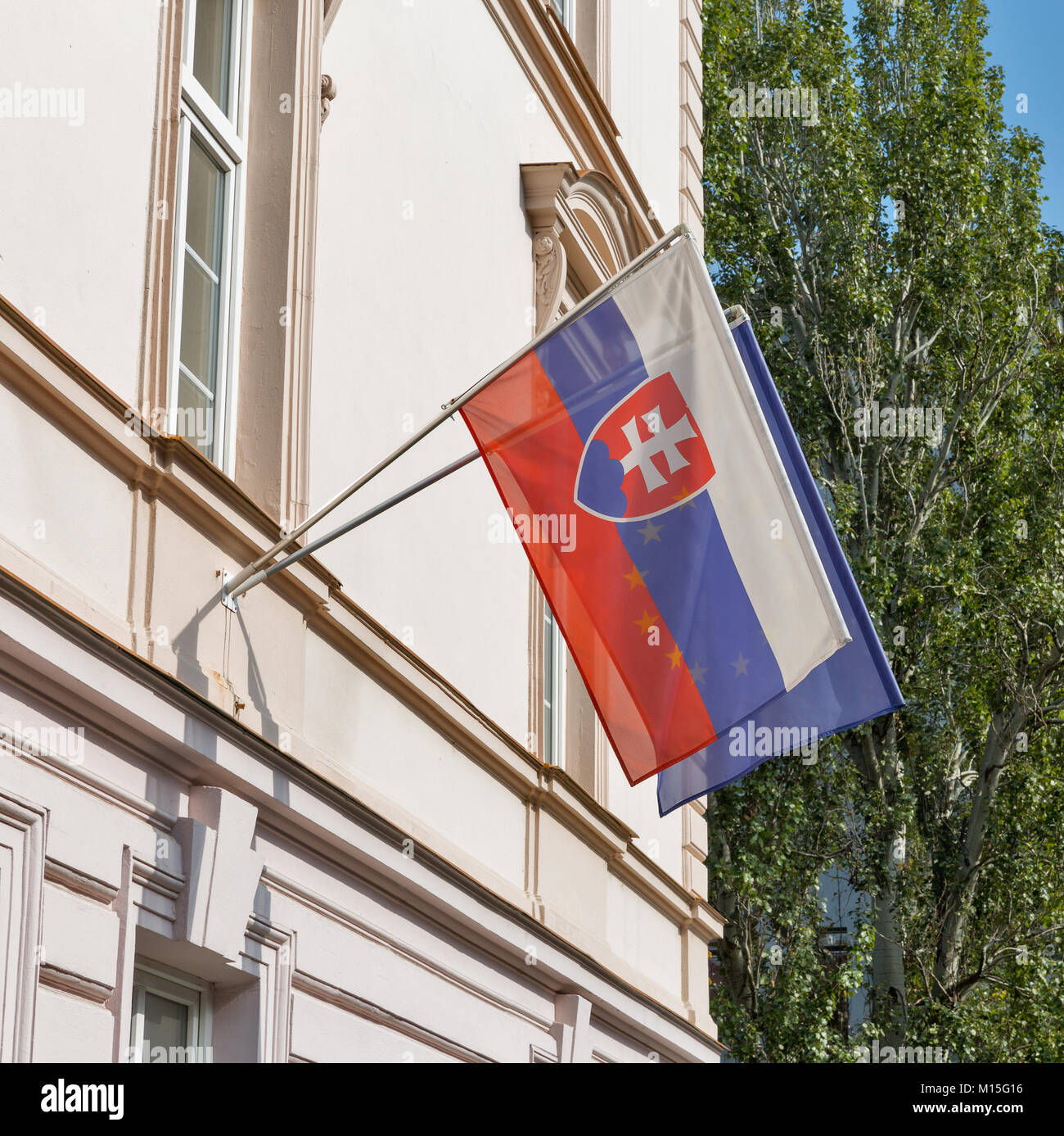 Flags of Slovakia and European Union outdoor closeup in Bratislava. Stock Photo