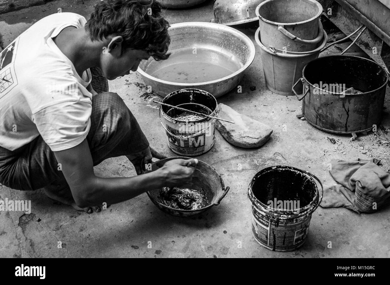 YANGON, MYANMAR NOVEMBER, 2016 Manual workers in laquer factory. The factory produces