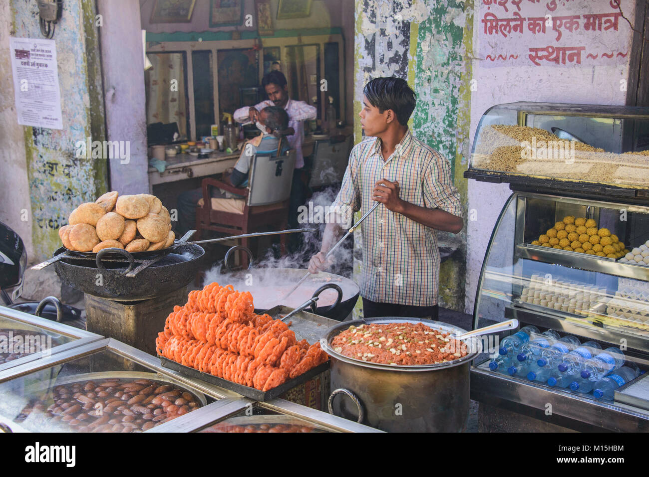 Indian boy cooking confections, Pushkar, Rajasthan, India Stock Photo