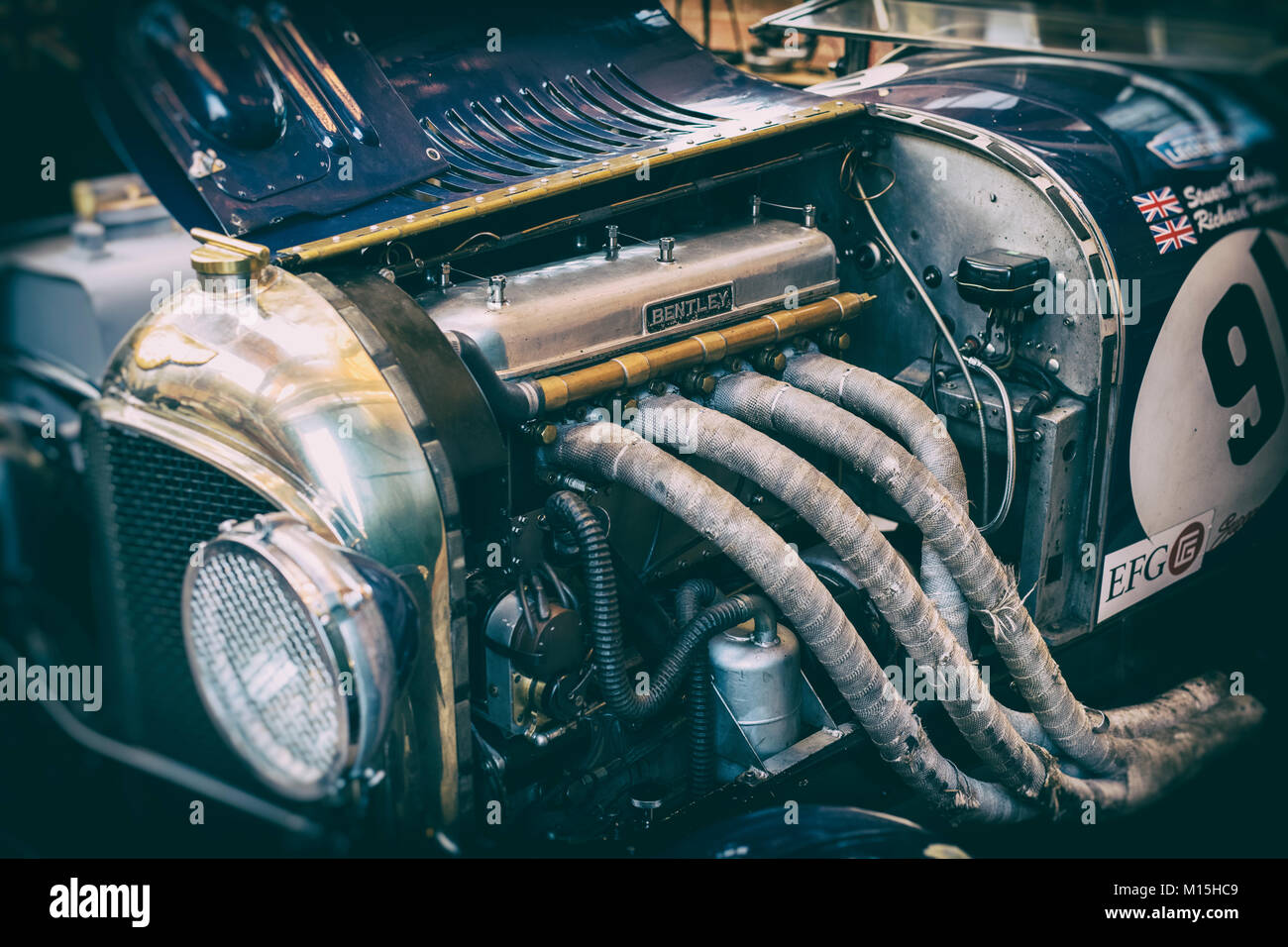 1926 vintage Bentley 3L car with open bonnet displaying the engine at Bicester Heritage Centre. Bicester, Oxfordshire, England. Vintage filter applied Stock Photo