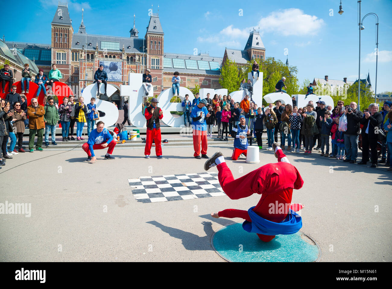 Amsterdam, Netherlands - April 20, 2017: Youth break dancing on city streets in Amsterdam. Street festival breakdance. Stock Photo