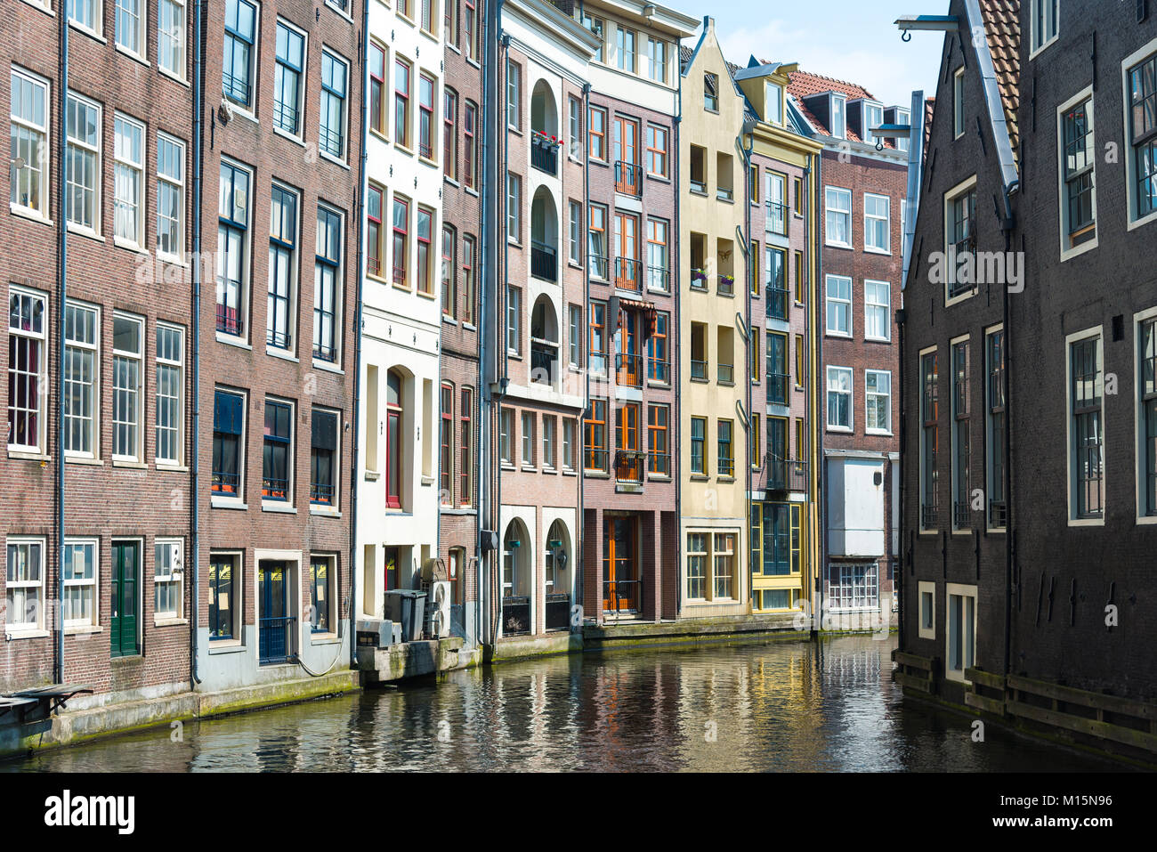 Amsterdam, Netherlands - April 20, 2017: Traditional old buildings in Amsterdam in spring, the Netherlands Stock Photo