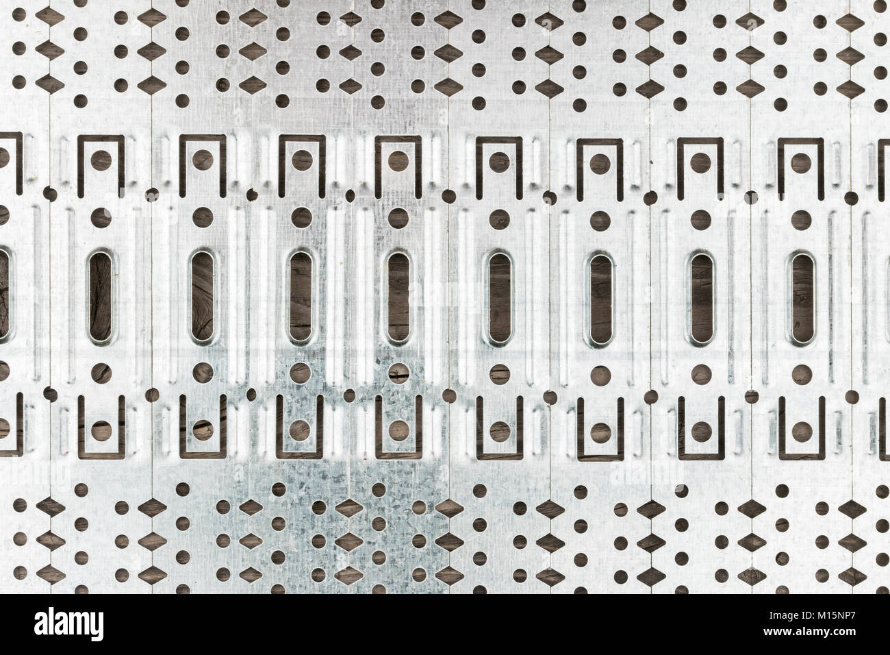 Abstract background of perforated metal plates. View from above Stock Photo