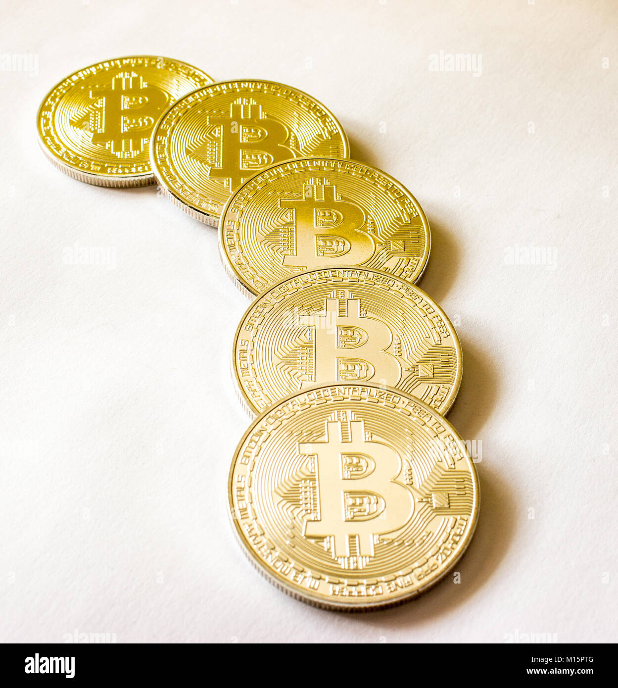 On a grey background are gold coins of a digital crypto currency Bitecoin  Stock Photo - Alamy