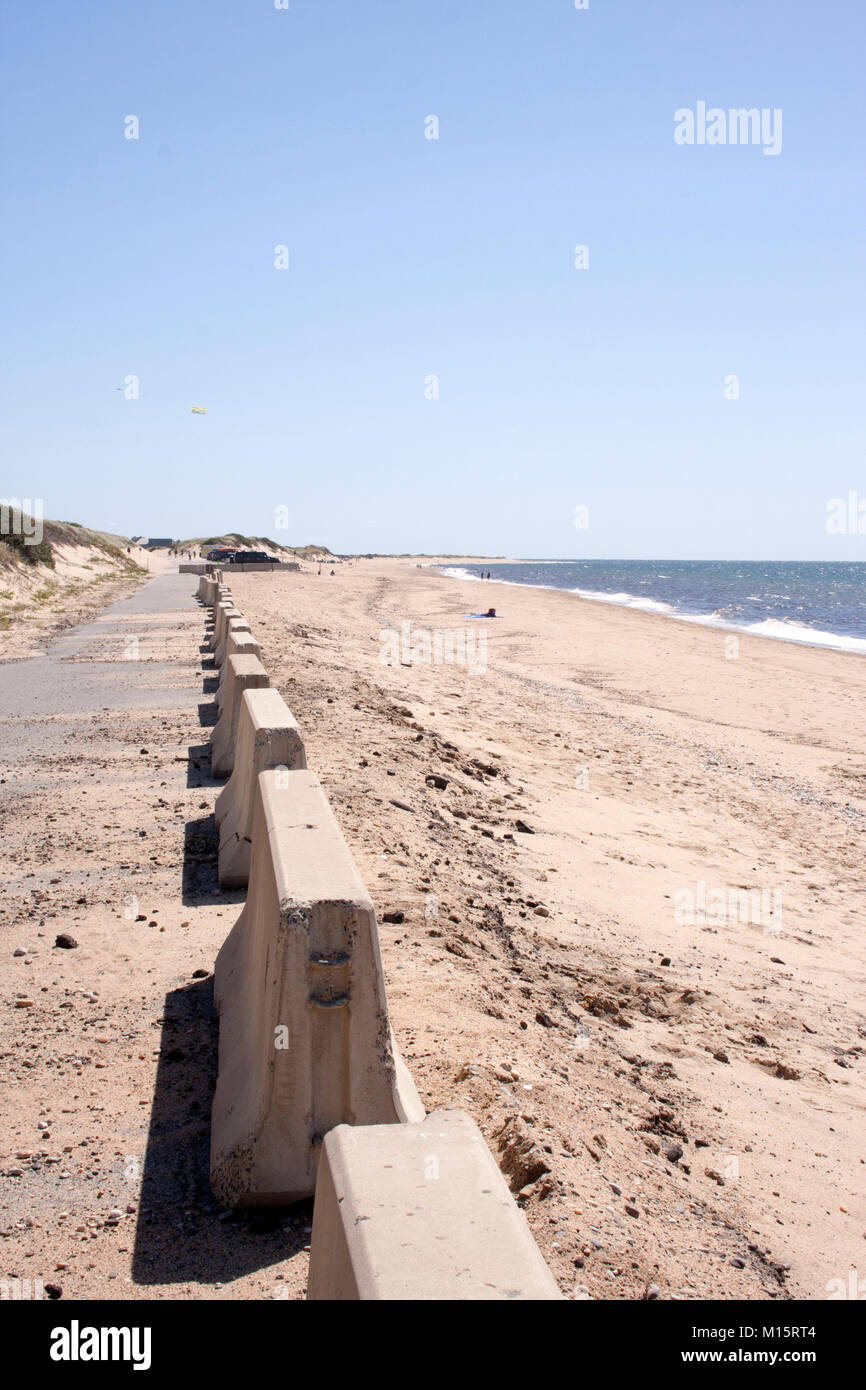 Concrete dividers between the path and sand of Herring Cove Beach, in