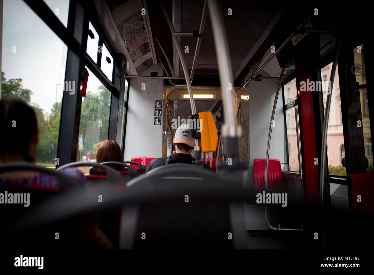 Man from behind sitting in a bus in Prague, Czech Republic Stock Photo