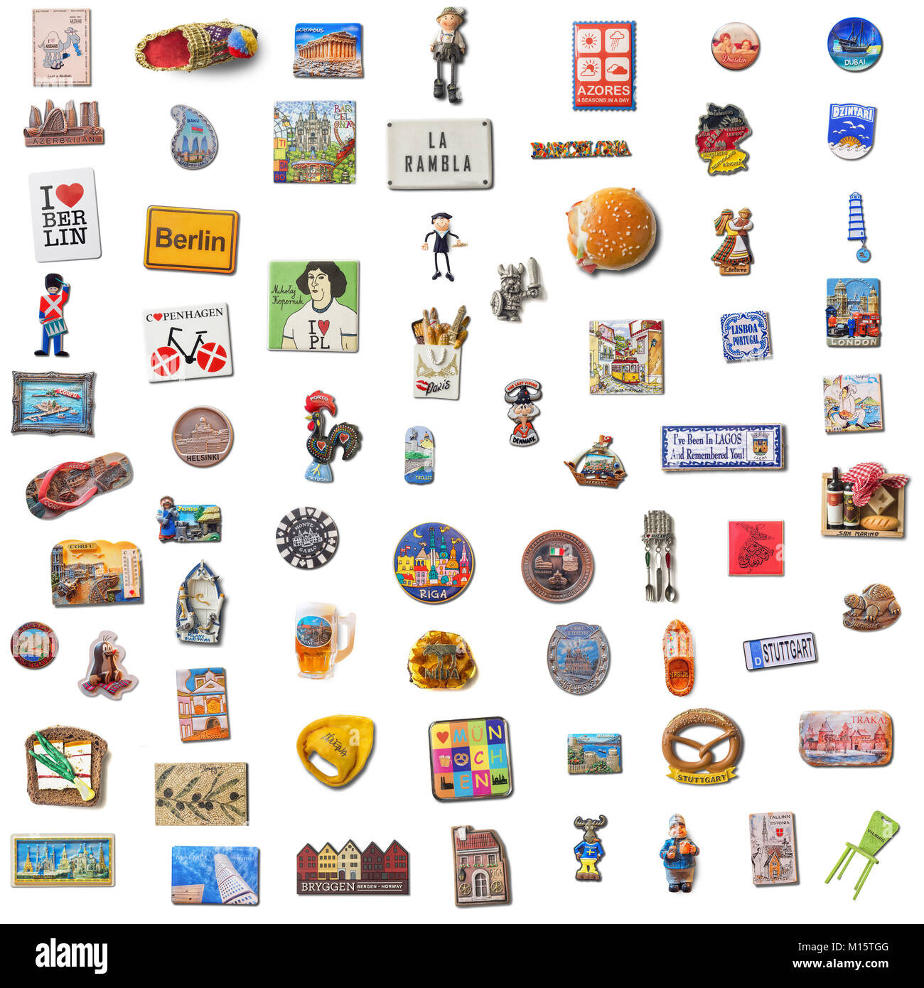 VILNIUS, LITHUANIA-JANUARY 2, 2017: Set of 70 souvenir refrigerator magnets isolated on white from different cities of the world. Refrigerator magnets Stock Photo