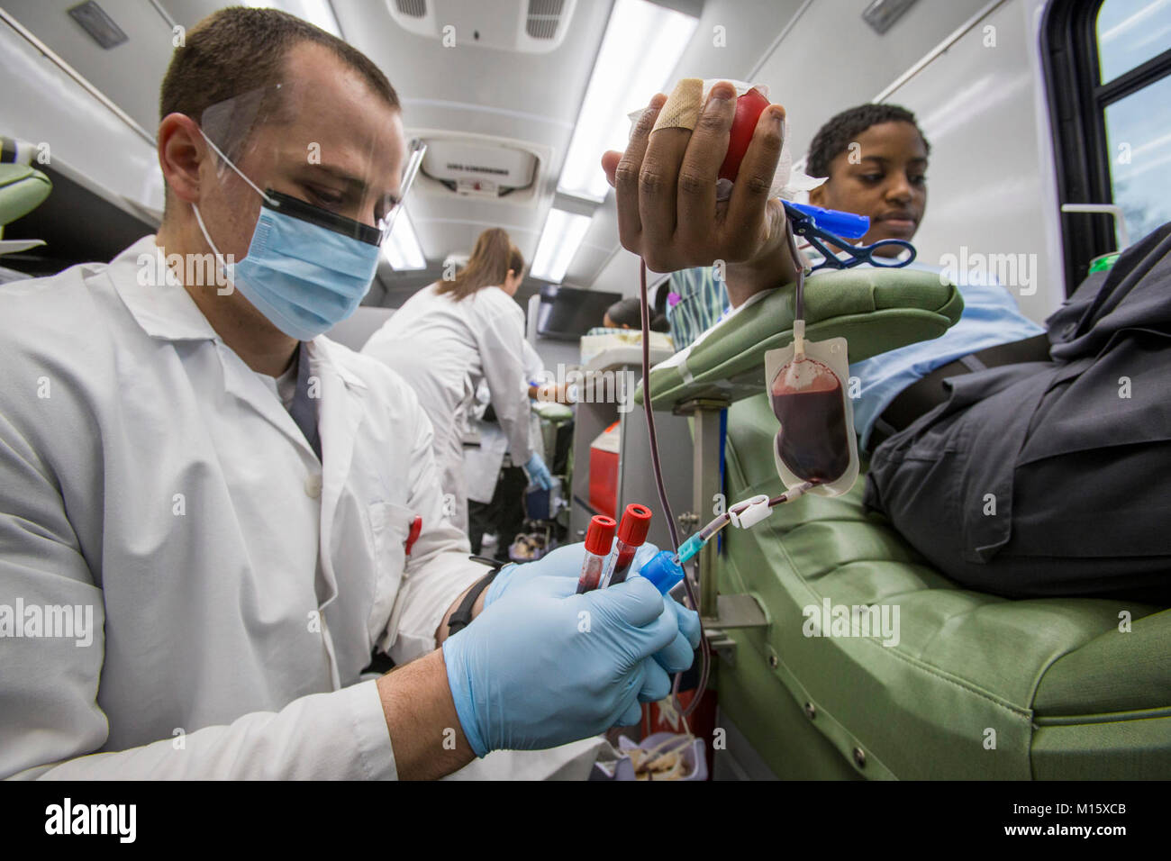 Phlebotomist Kevin Clark, left, Miller Keystone Blood Center, Ewing, N.J., takes blood samples from Cadet Tatiana Constant during a blood drive at the New Jersey National Guard Youth ChalleNGe Academy at Joint Base McGuire-Dix-Lakehurst, N.J., Jan. 24, 2018. The Youth ChalleNGe Academy is an education program that provides 16 to 18 year-old high school dropouts the opportunity to undergo an intense 22-week structured residential program in a quasi-military environment and prepares them for the GED exam. (New Jersey National Guard Stock Photo