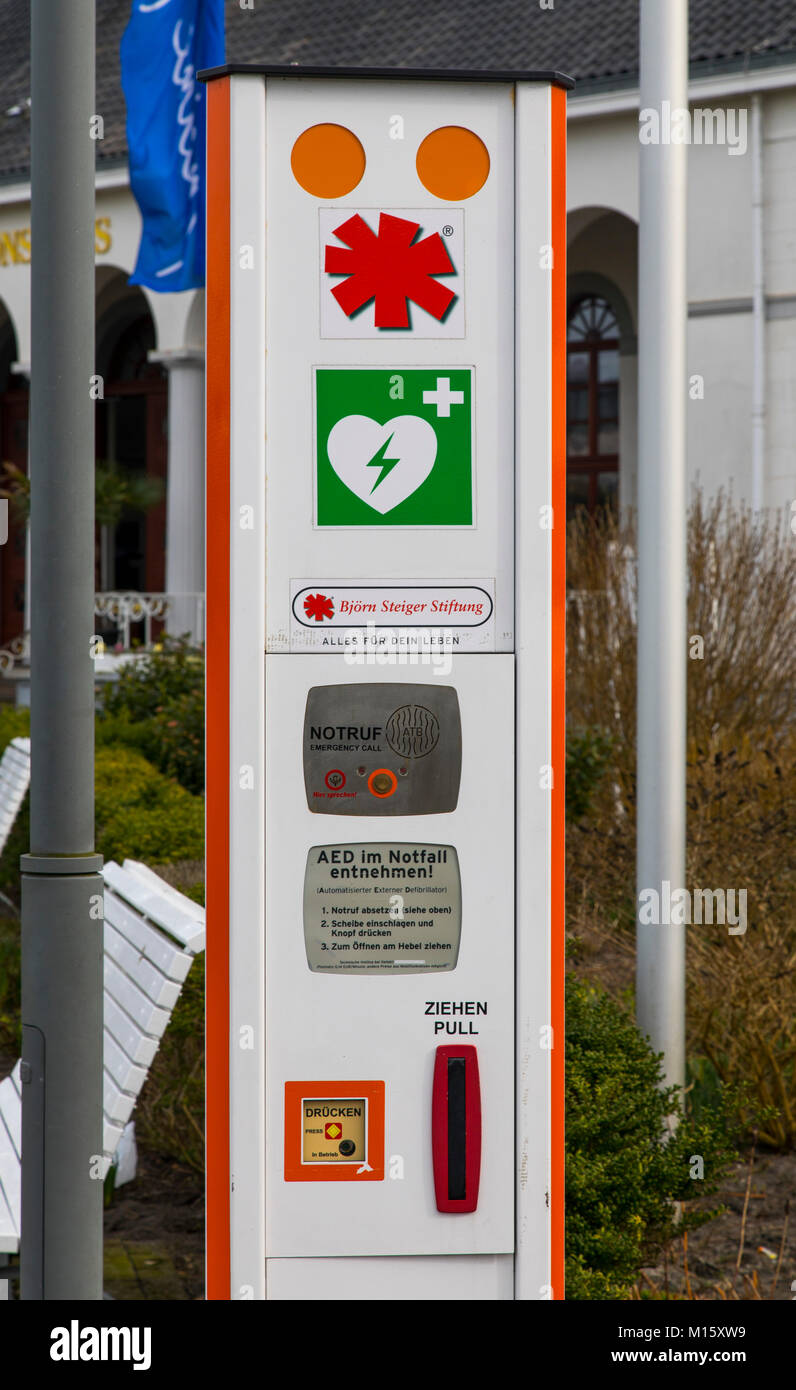 The East Frisian North Sea island of Norderney, rescue pillar with emergency call function and defibrillator, first aid, Germany, Stock Photo