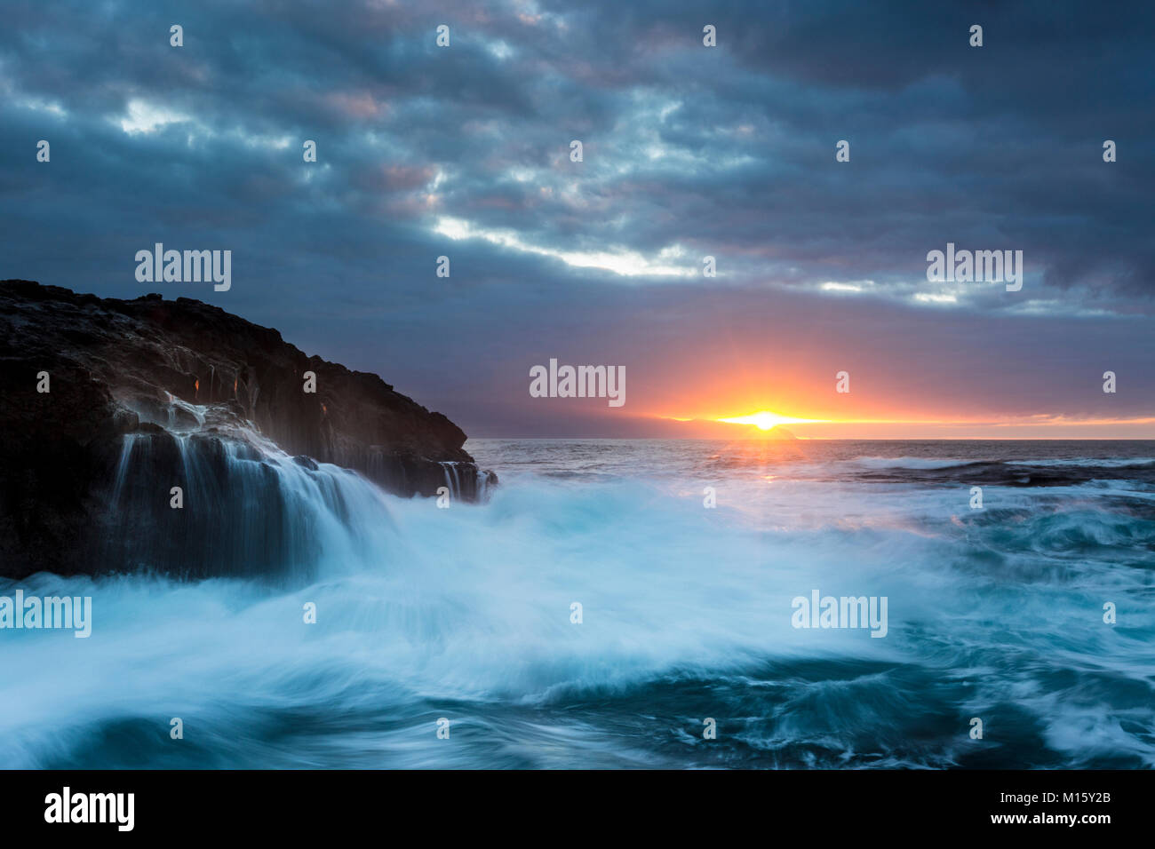 Surf,rocky coast with foaming waves at sunset,Puerto de la Madera,Tacoronte,Tenerife,Canary Islands,Spain Stock Photo