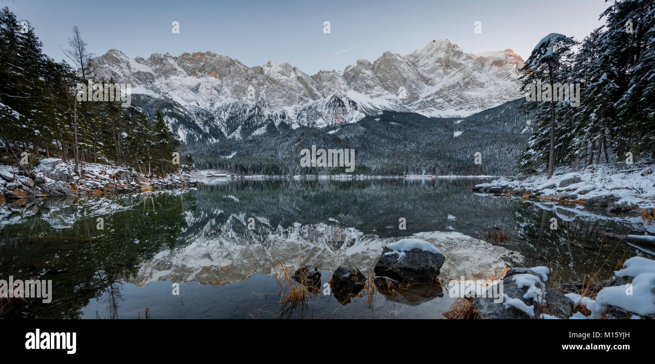 Lake Eibsee lake in winter with Zugspitze,Spiegelung,Wetterstein range,Upper Bavaria,Bavaria,Germany Stock Photo