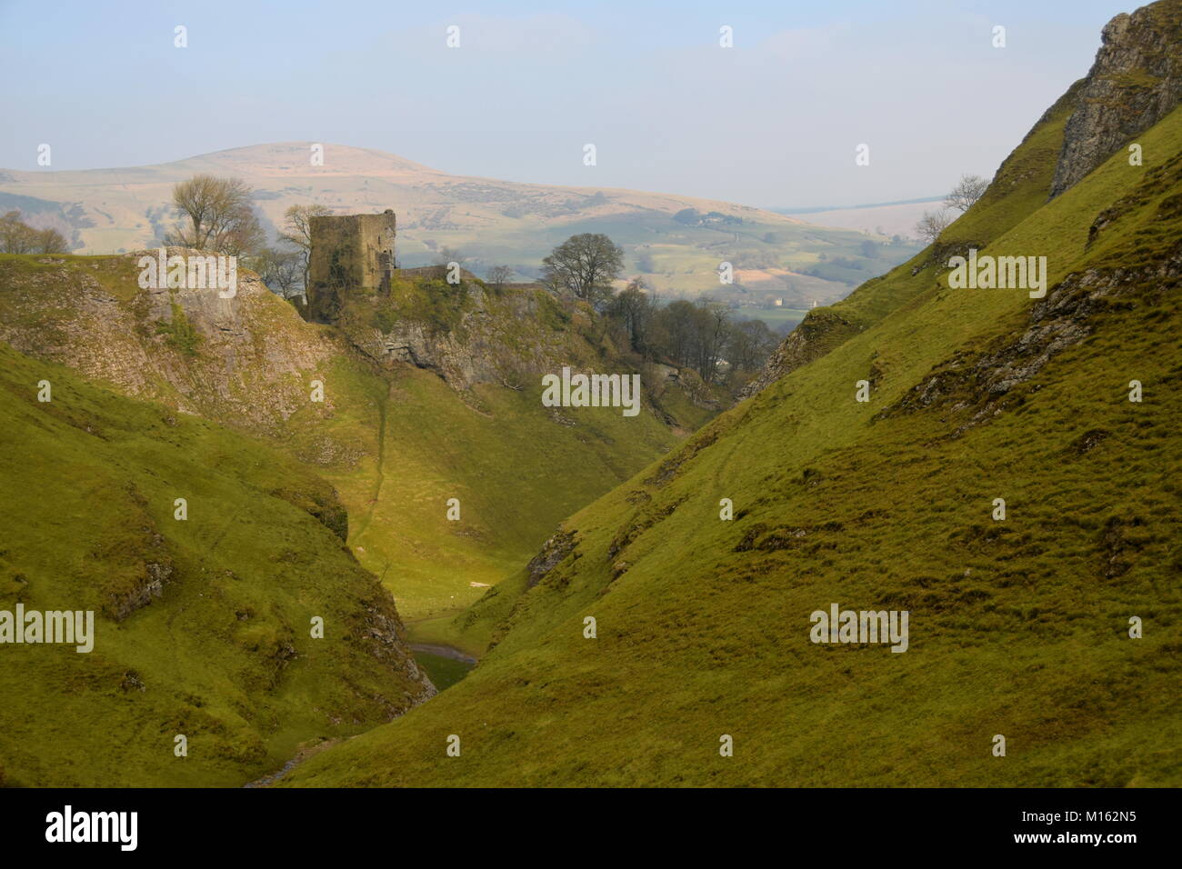 Peveril Castle, a ruined 11th-century castle overlooking the village of Castleton in the English county of Derbyshire Stock Photo
