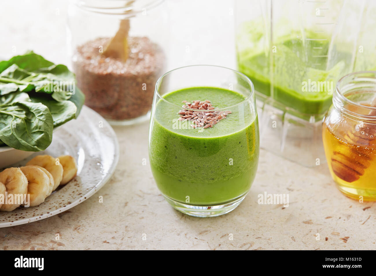 Healthy green smoothie made with spinach, banana and flax seed. Green
