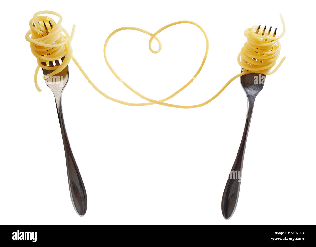 Swirls of cooked spaghetti with fork. Spaghetti heart shape Stock Photo