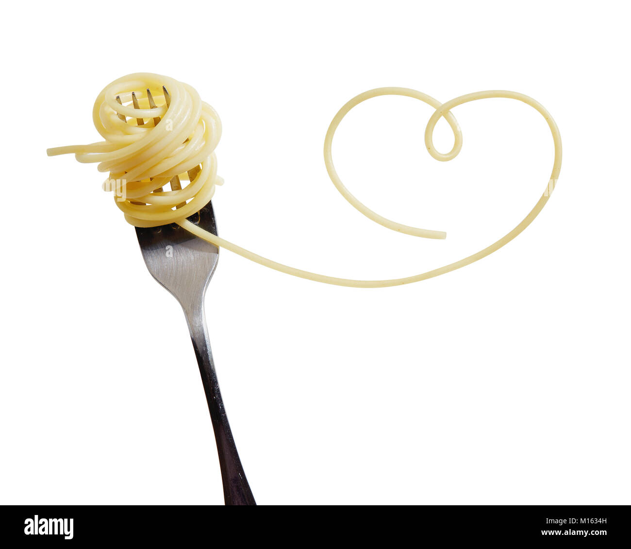 Swirls of cooked spaghetti with fork. Spaghetti heart shape Stock Photo