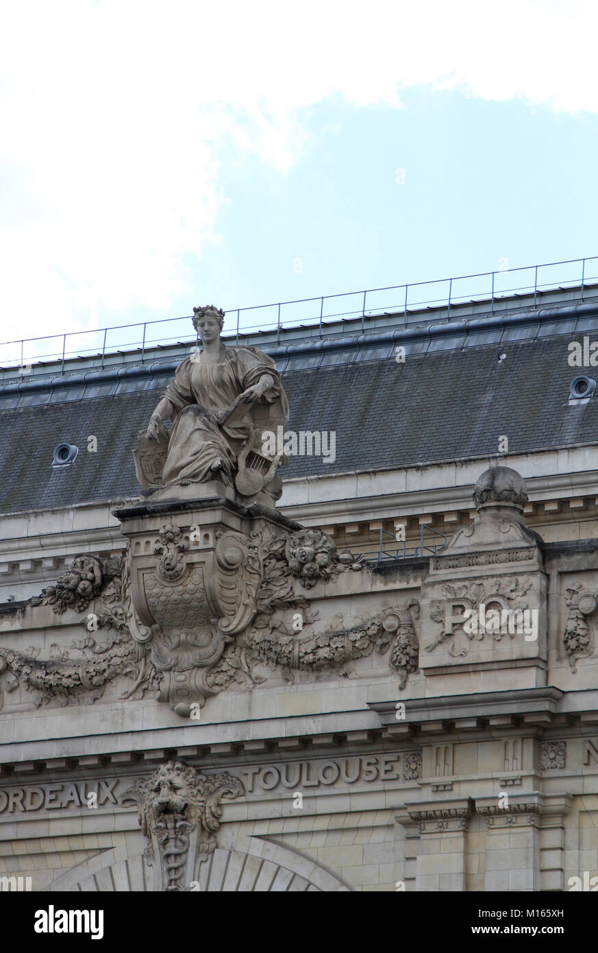 Statue with Book on the Roof Terrace of the Orsay Museum, Paris, France. Stock Photo