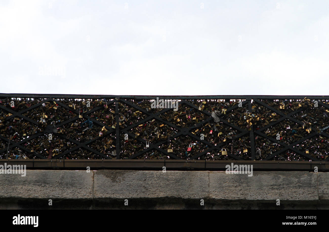 Love locks on the side railing of the Pont des Arts bridge, Seine River, Paris, France. Stock Photo