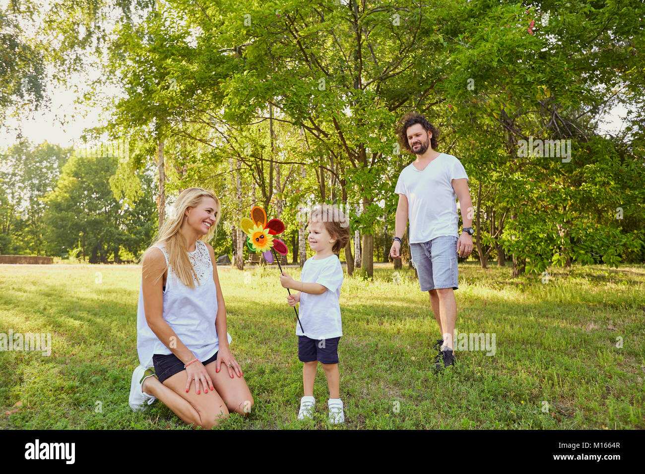 Happy family in the park Stock Photo - Alamy