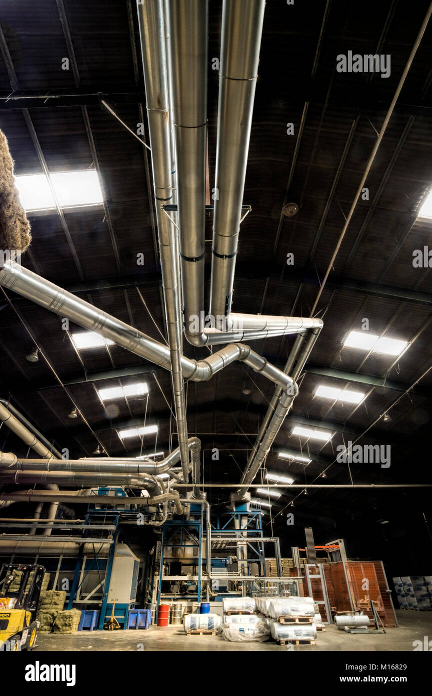 Air conditioning and dust control pipework in a UK plant processing hemp fibre. Stock Photo