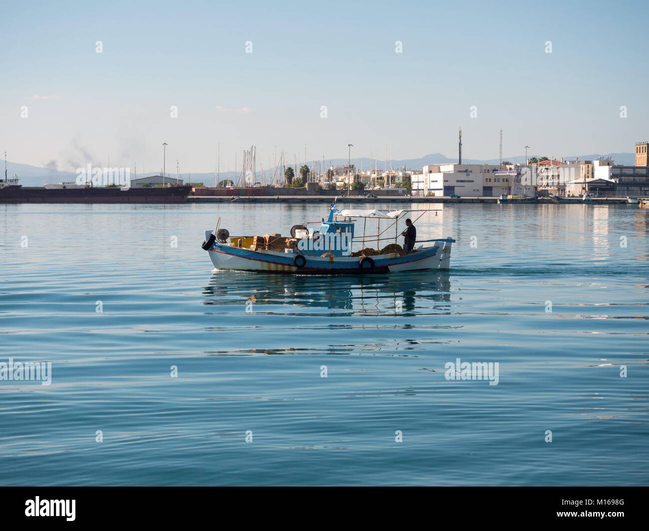 Fishing boat leaving the port of Kalamata, Greece Stock Photo Alamy