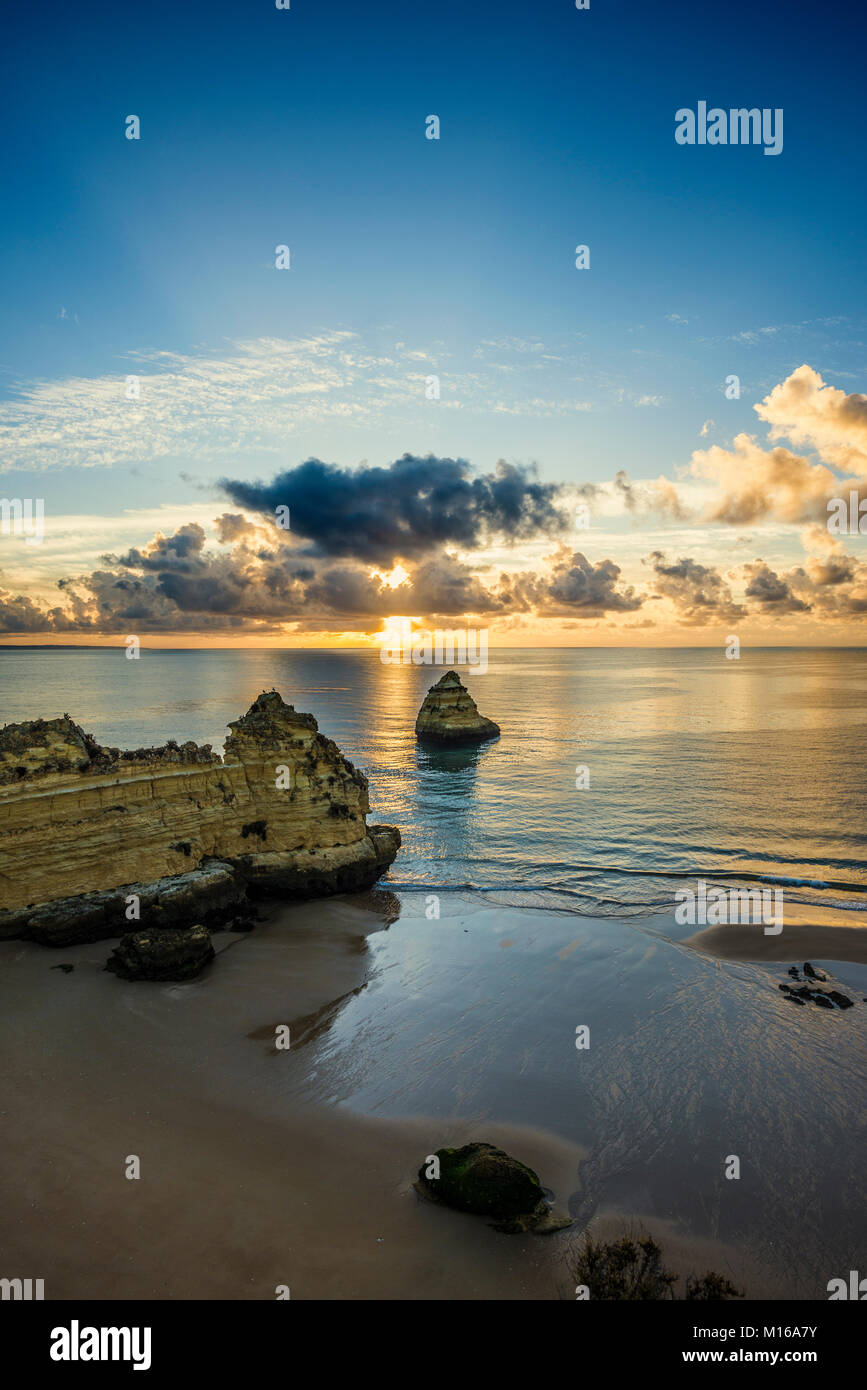 Coloured cliffs and sunrise at the beach, Praia da Dona Ana, Lagos, Algarve, Portugal Stock Photo