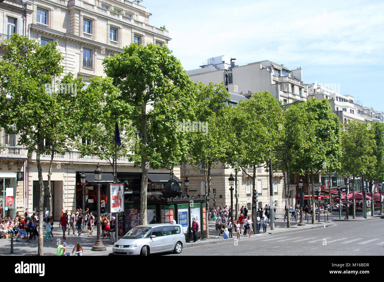 Shops and apartment buildings, The Avenue des Champs-Elysees, Paris, France. Stock Photo