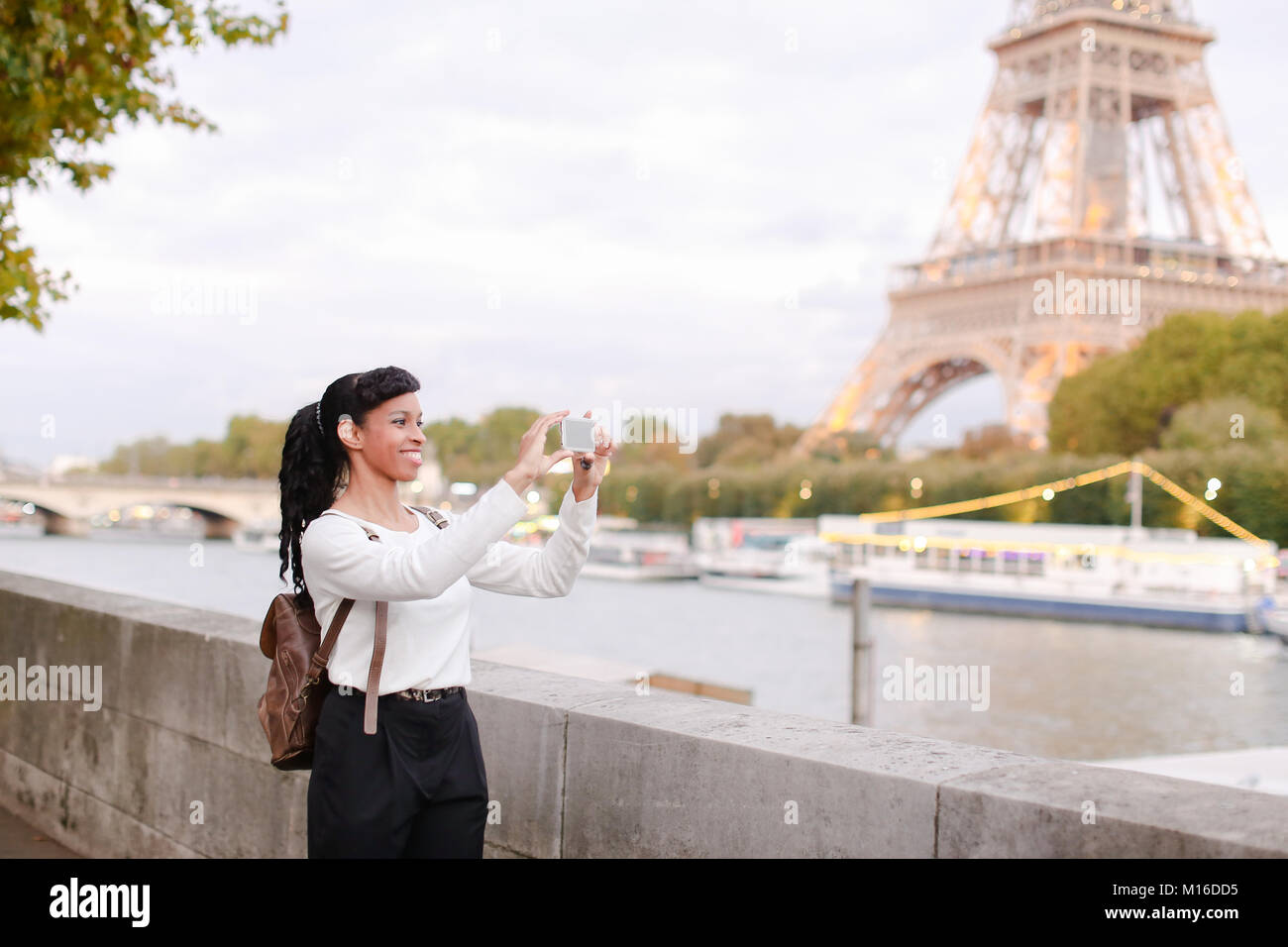 Student walking on street and taking pictures of attractions usi Stock ...