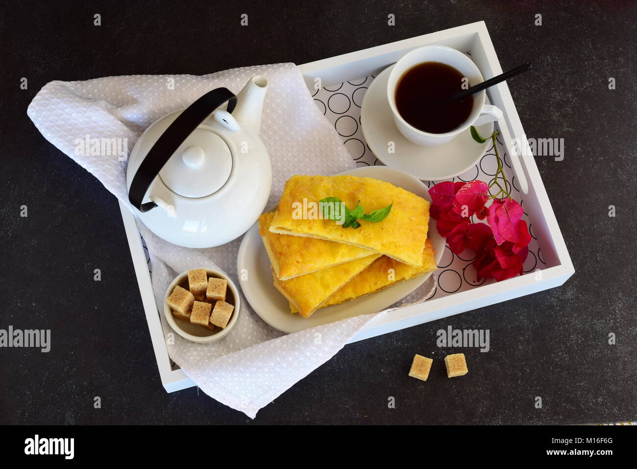 Cheesy pancakes with tea on a wooden tray. Ideas for breakfast. Romantic breakfast. Love, St. Valentine-s Day Stock Photo